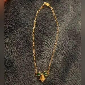 Avon Vintage Gold Tone Enamel Holly & Bell Bracelet, new without tags